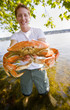 Man holding crab Man holding crab