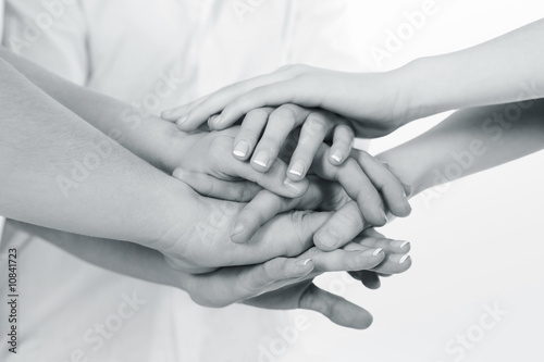 Photo: Business team put hands together Business team put hands together