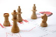 chess man over business chart
