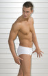 Photo: sexy muscled man under the sun with swim suit sexy muscled man under the sun with swim suit