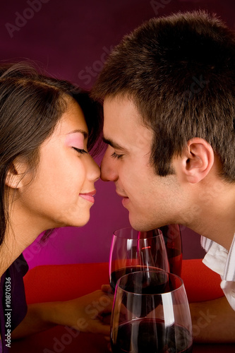 Photo: Couple Getting Closer While Having Wine Couple Getting Closer While Having Wine