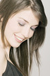 Young Woman face with make up, strasses on her eyelids (studio)