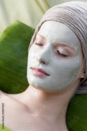 Photo: Young Woman face with beauty mask, shut eyes Young Woman face with beauty mask, shut eyes