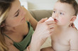 Photo: Mother wiping baby's nose Mother wiping baby's nose