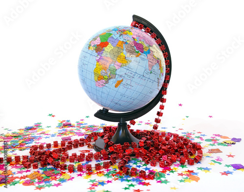 Photo: World globe and colorful confetti World globe and colorful confetti
