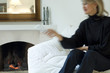 Woman using a remote-control in a living-room