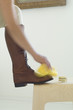 Woman polishing boots, close-up