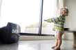 Little boy holding TV remote control