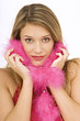 Foto: Portrait of a young woman with a feather boa around her neck Portrait of a young woman with a feather boa around her neck