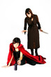 girl with a big knife sneaks up behind other girl