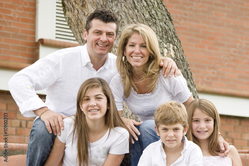Photo: Portrait of family, mom and dad with their three children Portrait of family, mom and dad with their three children