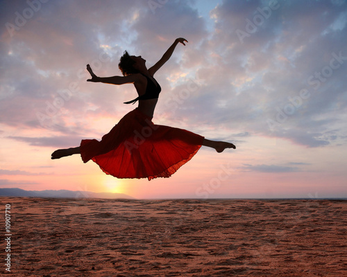 Photo: Jumping woman at sunset Jumping woman at sunset