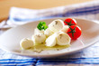 Pieces of mozzarella cheese and tomato