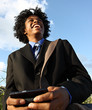 Photo: Young businessman texting Young businessman texting