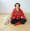 woman with headphons and dog