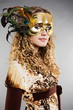 beautiful blond in venetian mask with feathers