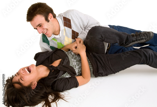 Photo: Young Girl being Tickled by Young Man Young Girl being Tickled by Young Man