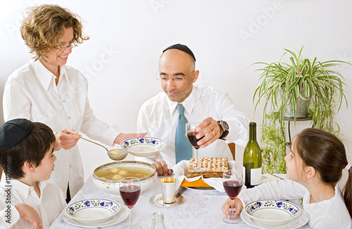 Photo: jewish family celebrating passover jewish family celebrating passover