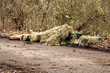 Photo: Soldier in camouflage, lies ready for the shot Soldier in camouflage, lies ready for the shot