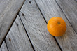 Orange on wooden floor