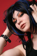 Blue haired punk girl on red background