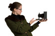 Young woman with old photographic camera.