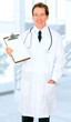 Happy Senior Doctor Showing Empty Board
