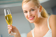 Portrait of young beautiful woman with champagne glass