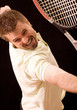 Young tennis player is trying to reach the ball