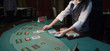 croupier handling cards at poker table croupier handling cards at poker table