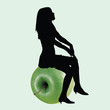 A girl sitting on the apple
