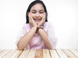 portrait of an asian teenage girl covering her ears