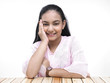 portrait of an asian teenage girl covering her ears