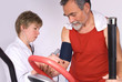Photo: Senior is being observed by doctor after training Senior is being observed by doctor after training