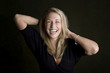 Pretty woman with blue eyes laughing