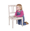 kneeling near chair young girl