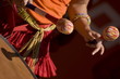 Women playing the orange drum.