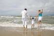 Family having fun in the waves Family having fun in the waves