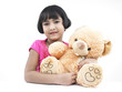 portrait of an asian girl with her brown teddy bear