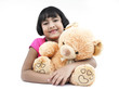 portrait of an asian girl with her brown teddy bear