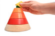 Putting Last Piece on Toy Pyramid Putting Last Piece on Toy Pyramid