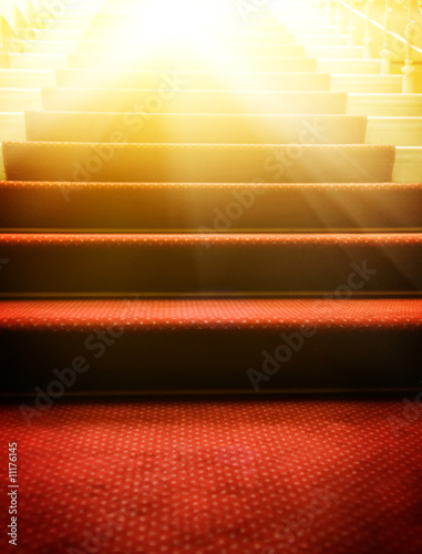 Stairs covered with red carpet