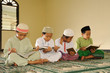 Muslim kids reciting Holy Koran