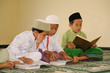 Muslim kids reciting Holy Koran