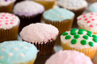 Assorted cupcakes with colorful frosting and various sprinkles Assorted cupcakes with colorful frosting and various sprinkles