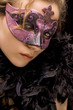mysterious blond woman wearing purple carnival mask mysterious blond woman wearing purple carnival mask