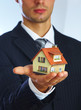 Hand of the businessman with the house
