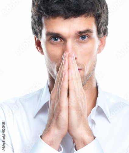 Photo: Closeup portrait of a pensive young businessperson Closeup portrait of a pensive young businessperson