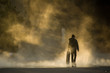 Skateboarder in mist