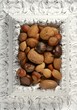 wooden decorated classic white frame, varied nuts wooden decorated classic white frame, varied nuts